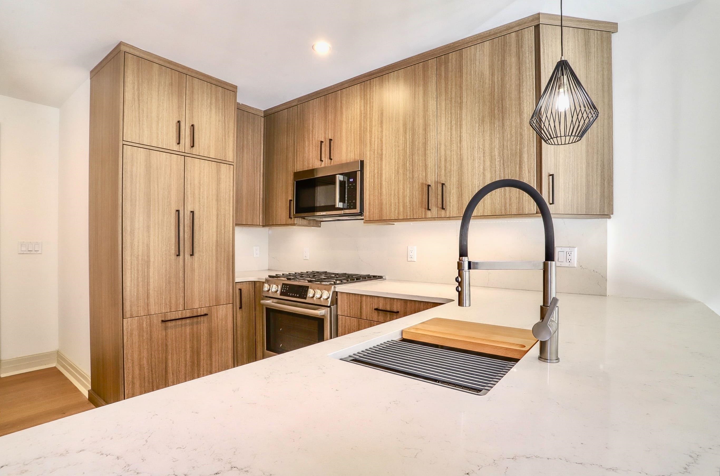 921 Madison Street, Unit 401 Hoboken, NJ 07030 - Photo 3 of 32 a kitchen with stainless steel appliances granite countertop a refrigerator a stove a sink and a microwave