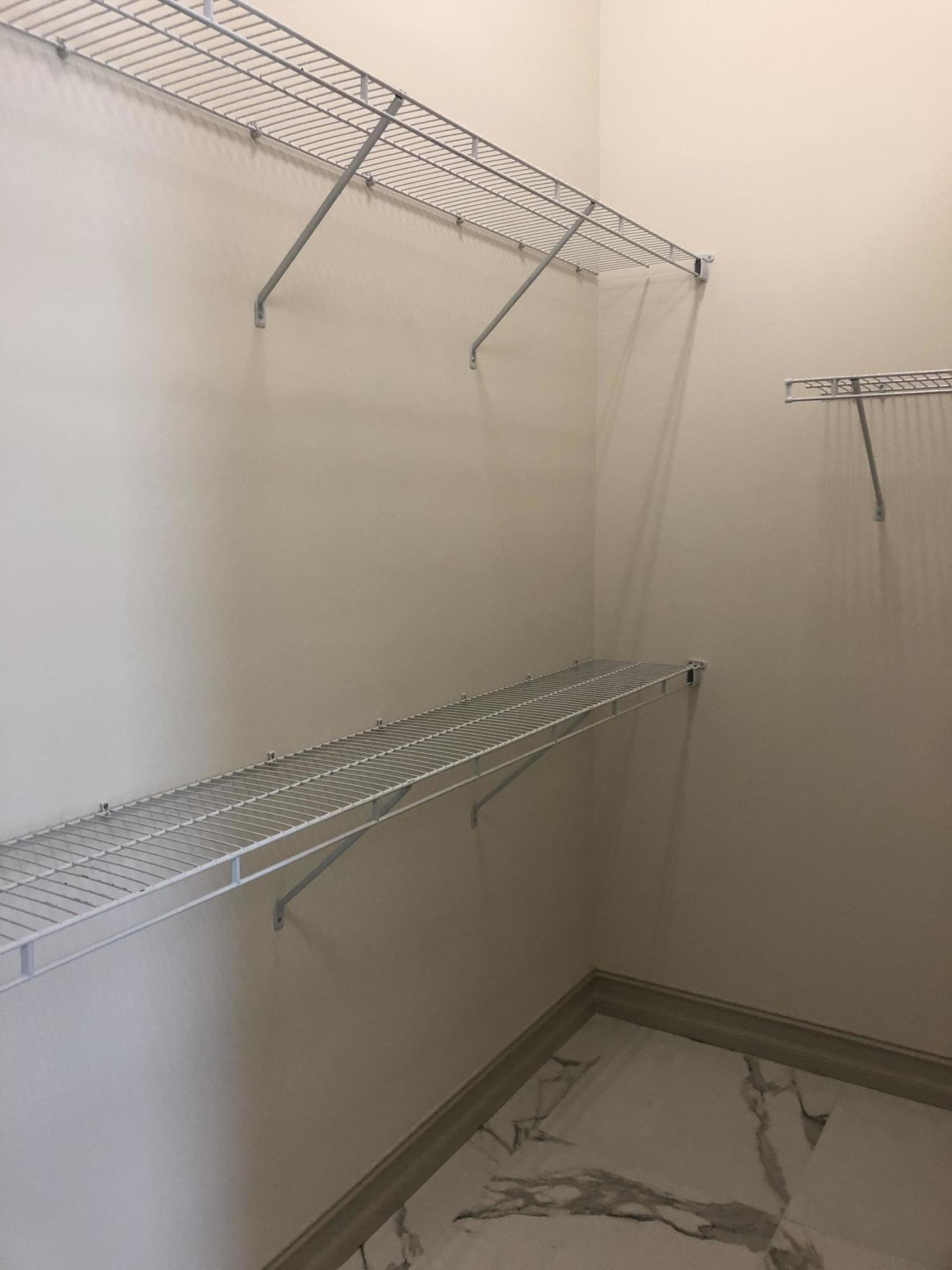 4936 Jefferson Road Delray Beach, FL 33445 - Photo 11 of 16 a view of a room with racks on the wall