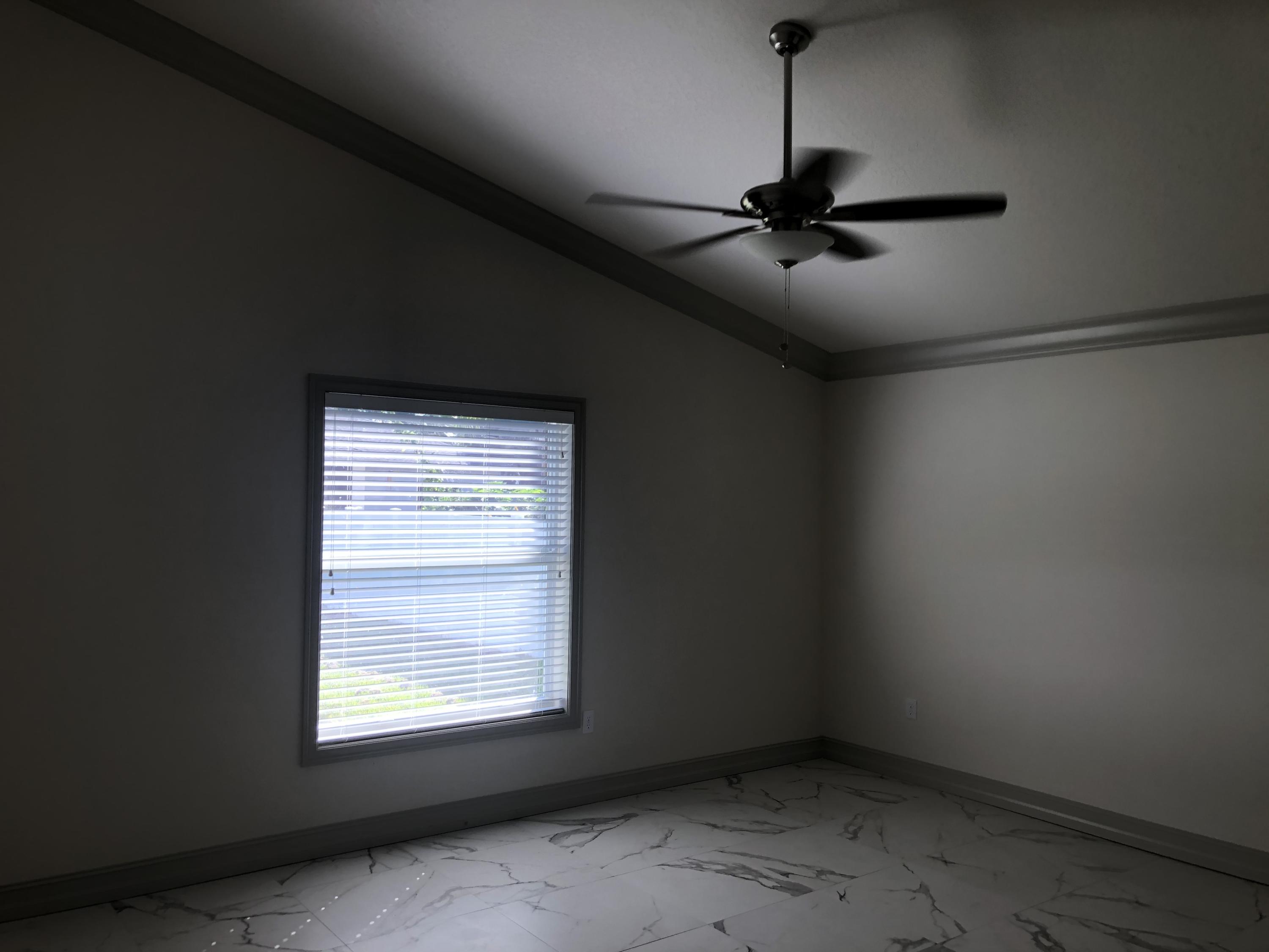 4936 Jefferson Road Delray Beach, FL 33445 - Photo 9 of 16 a view of an empty room with a window