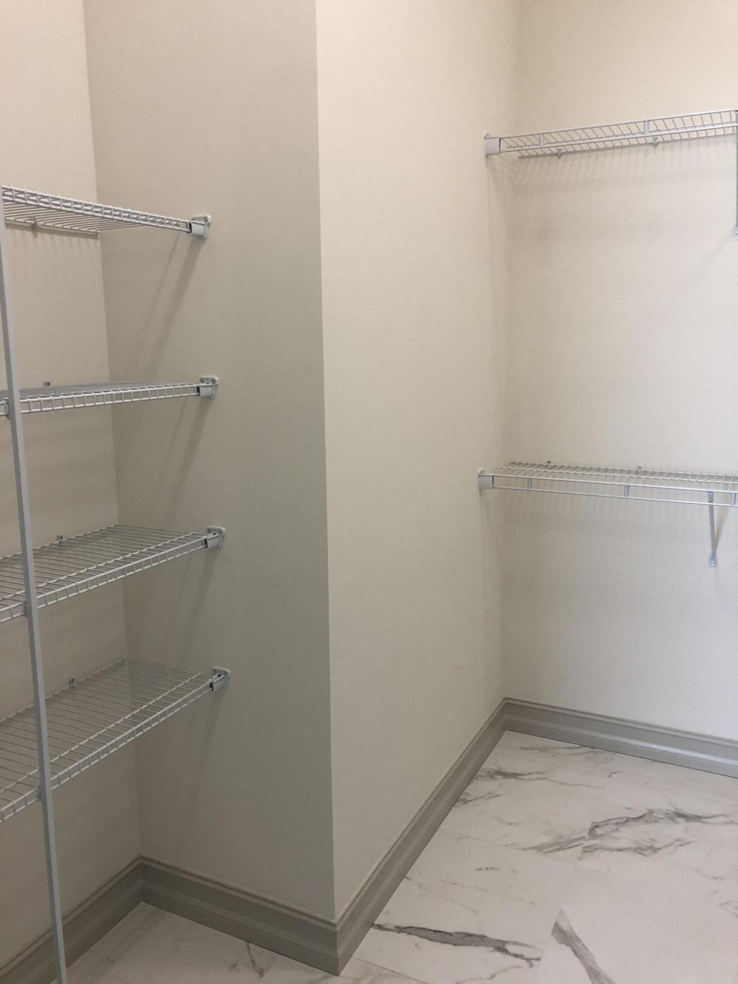 4936 Jefferson Road Delray Beach, FL 33445 - Photo 10 of 16 a view of a room with racks on the wall