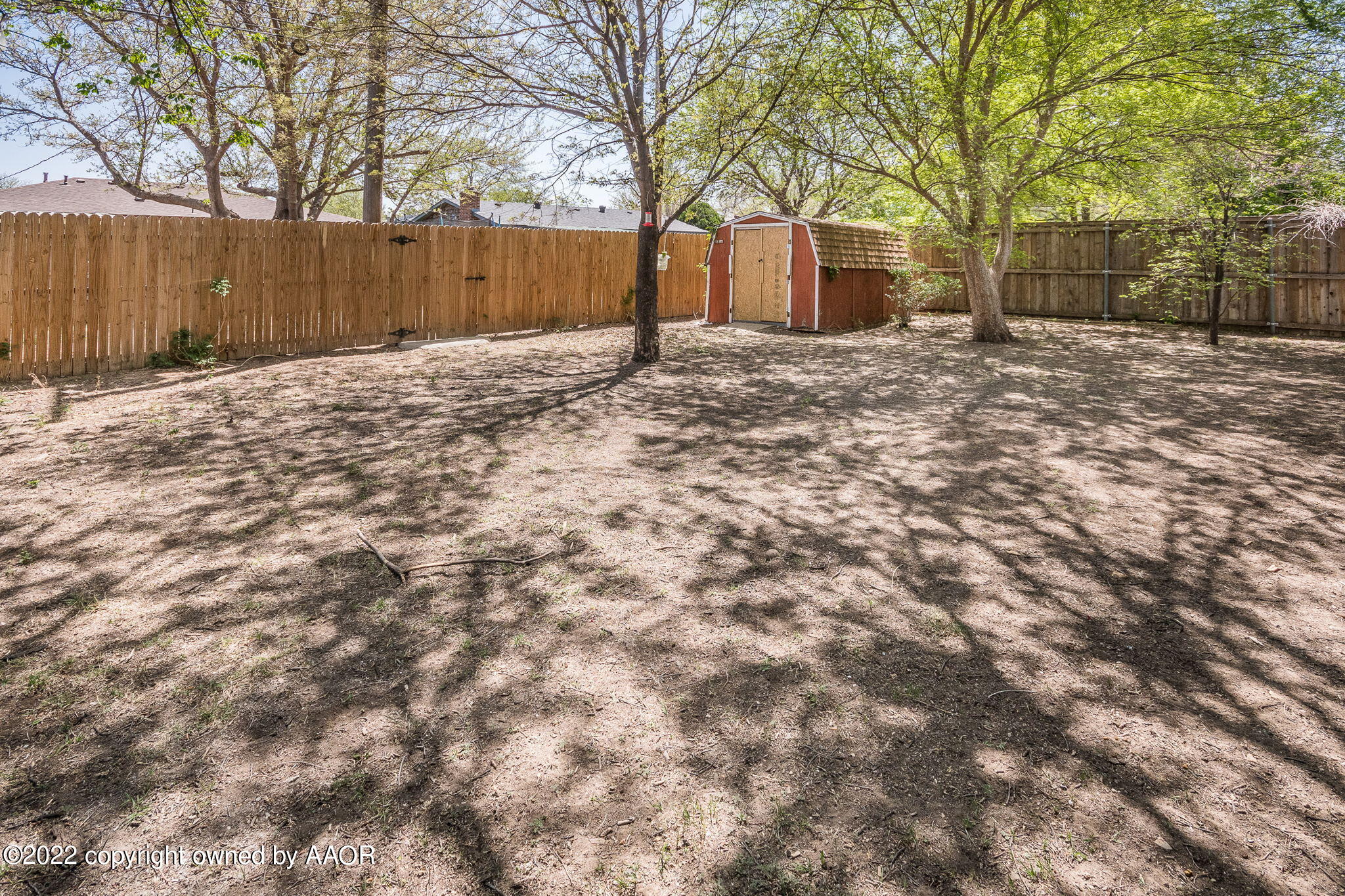 8205 Lamount Drive Amarillo, TX 79110 - Photo 19 of 21 a view of a yard with large trees