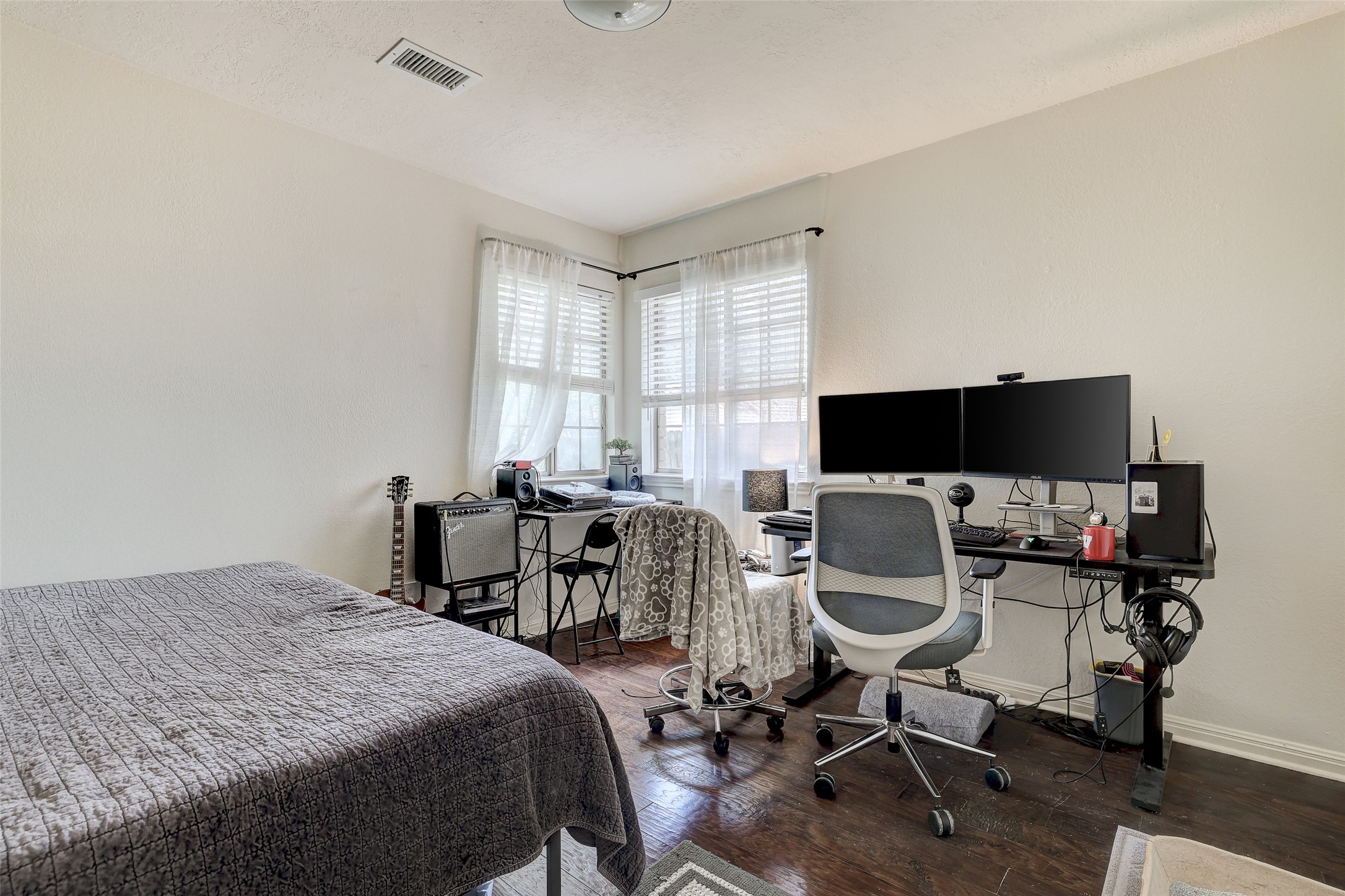 5907 Shanghai Pierce Road Austin, TX 78749 - Photo 24 of 29 Bedroom with wood finished floors and a desk
