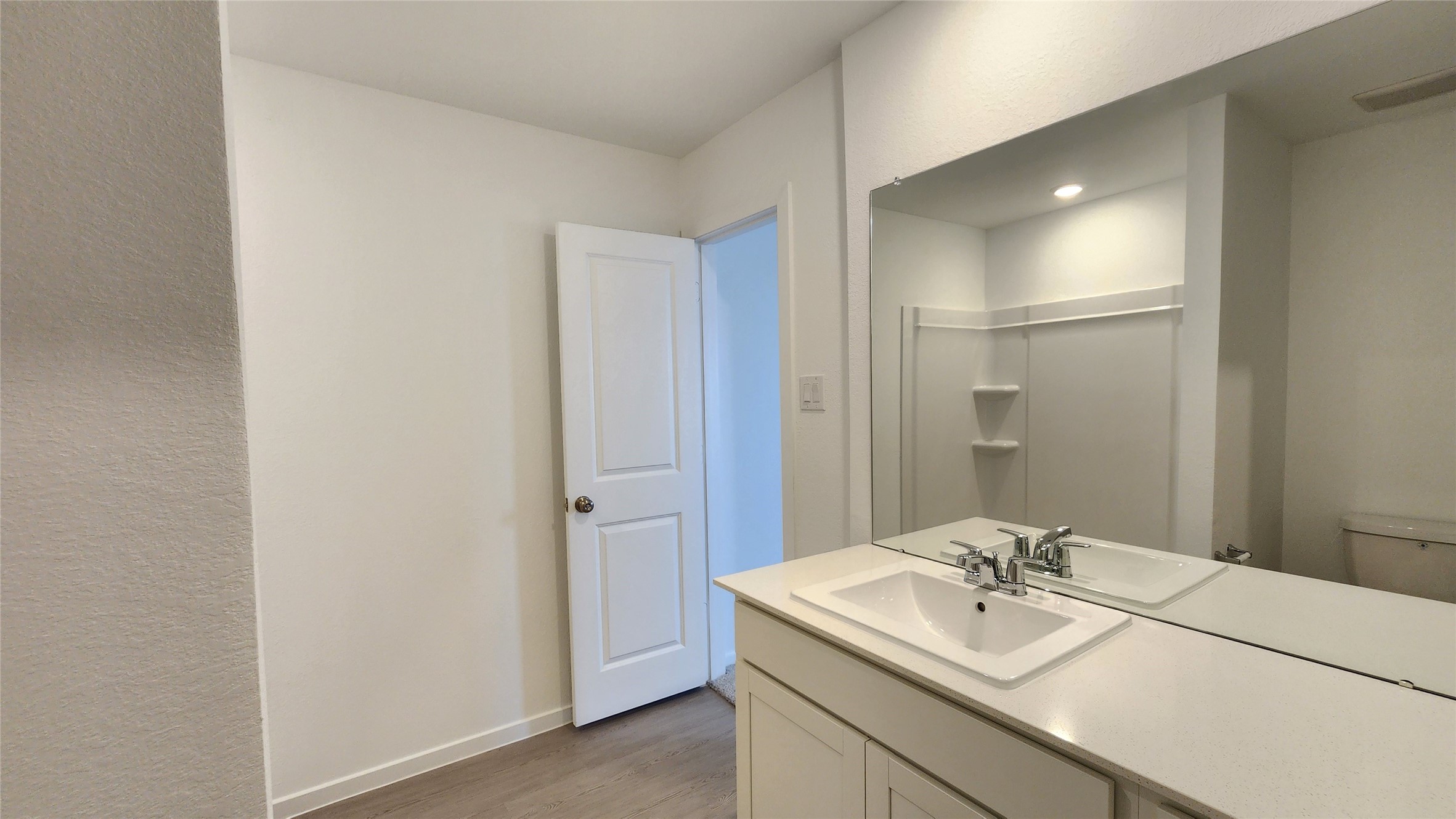 26850 Cascade Sunrise Street Katy, TX 77493 - Photo 14 of 40 a bathroom with a sink double vanity and a mirror