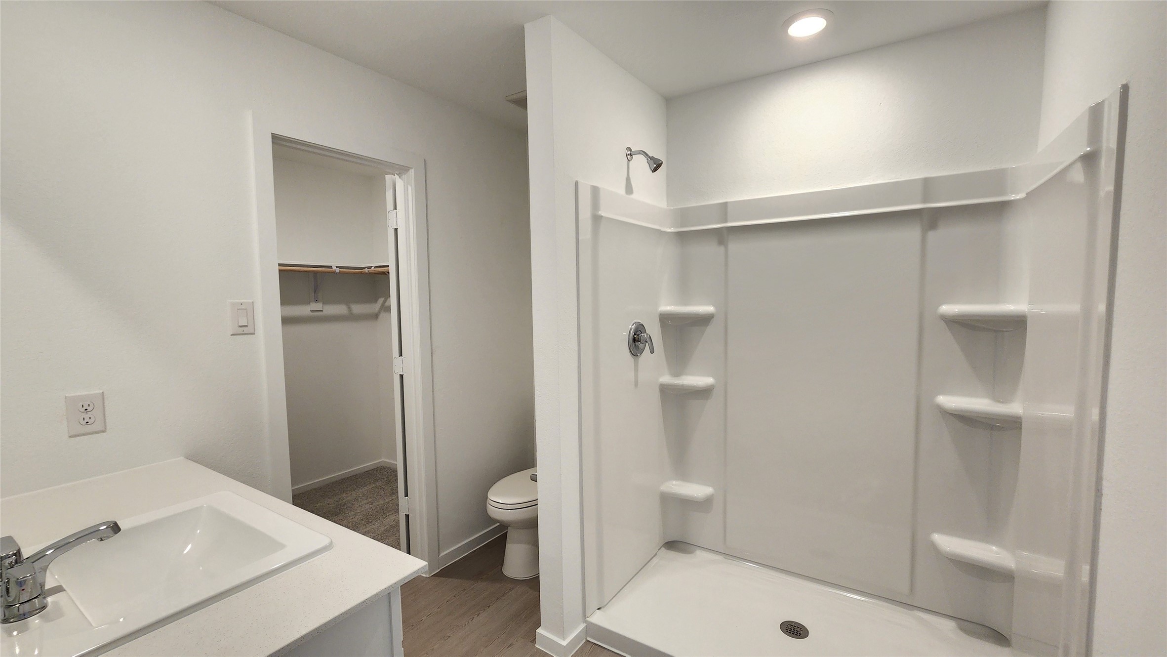 26850 Cascade Sunrise Street Katy, TX 77493 - Photo 16 of 40 a bathroom with a sink a toilet and shower