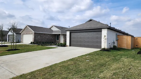 a kitchen with stainless steel appliances granite countertop a refrigerator a stove top oven a sink and dishwasher