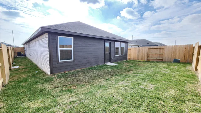 a view of a backyard of the house