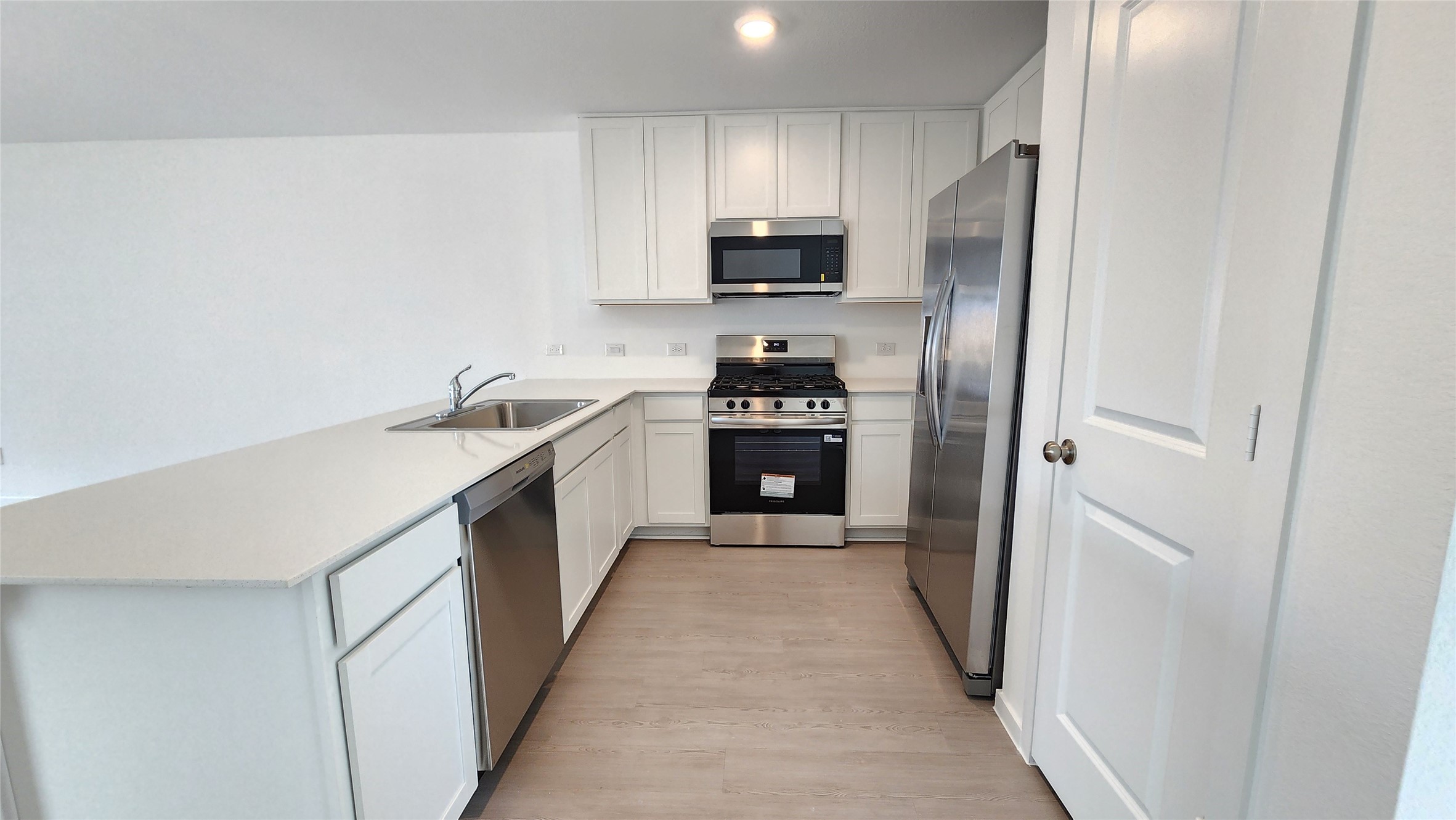 26850 Cascade Sunrise Street Katy, TX 77493 - Photo 4 of 40 a kitchen with stainless steel appliances granite countertop a refrigerator a stove top oven a sink and dishwasher