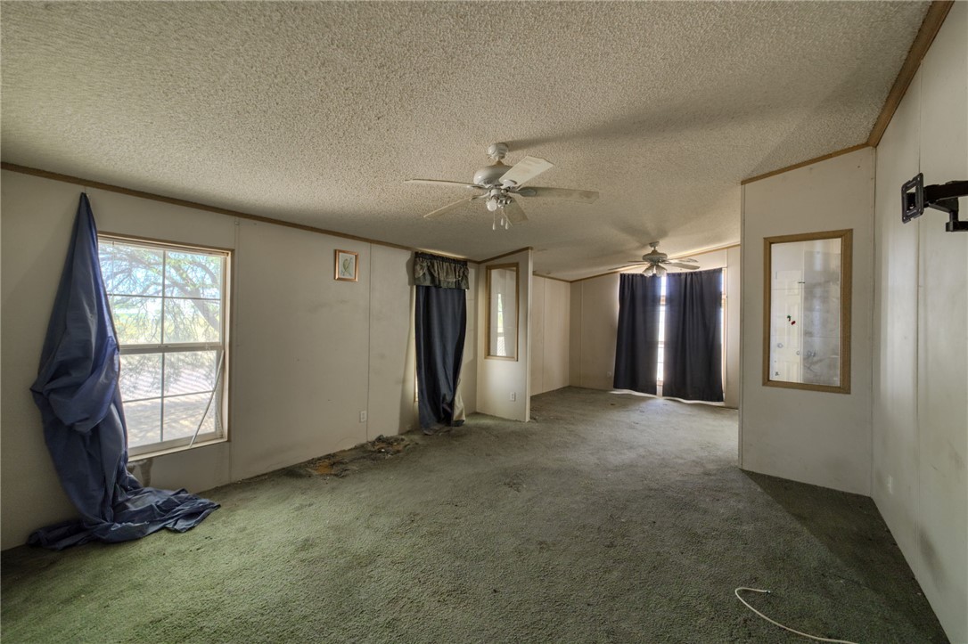 4745 Mormon Flat Road Golden Valley, AZ 86413 - Photo 7 of 49 an empty room with windows