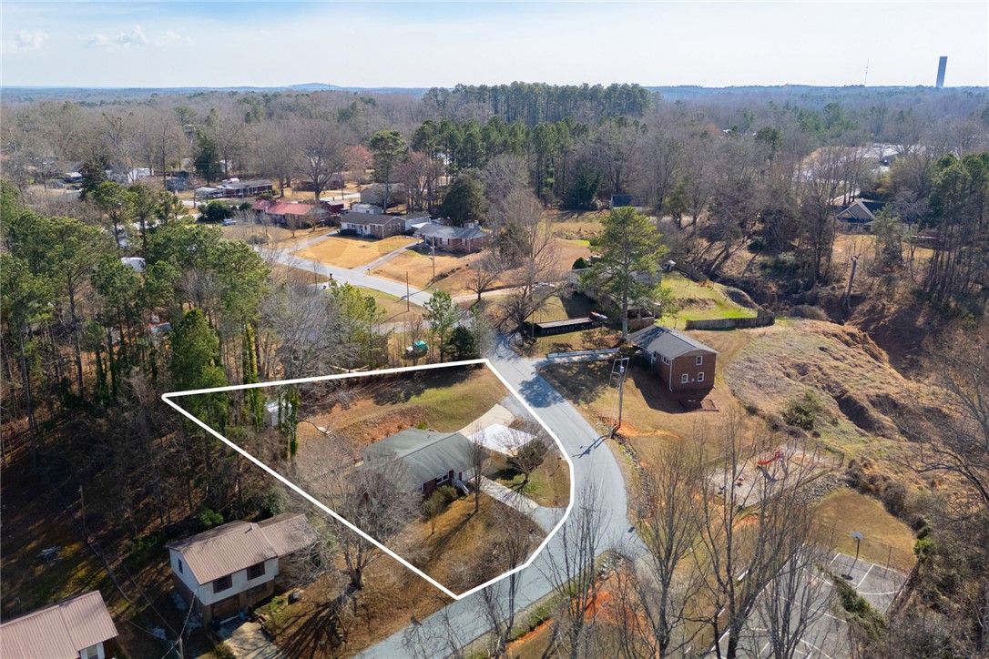 108 Hodge Street Abbeville, SC 29620 - Photo 38 of 39 Discover a spacious corner lot featuring mature trees and ample yard space for outdoor enjoyment.