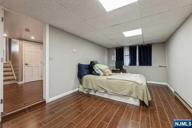 23 Asmus Road Closter, NJ 07624 - Photo 25 of 38 a bed room with a bed and a walk in closet
