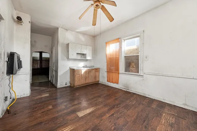 a view of a kitchen with a sink and a window