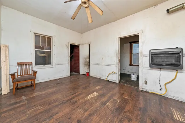 a bedroom with furniture and flat screen tv