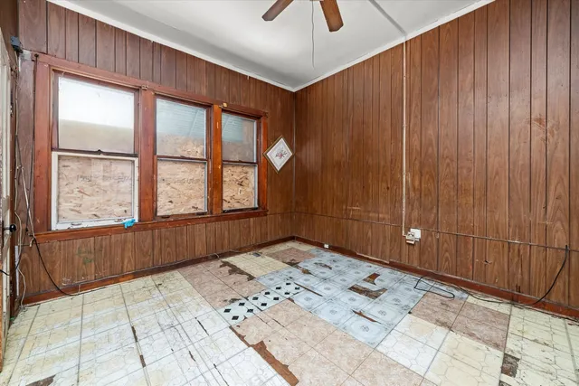 a view of a bedroom with a window and a bed