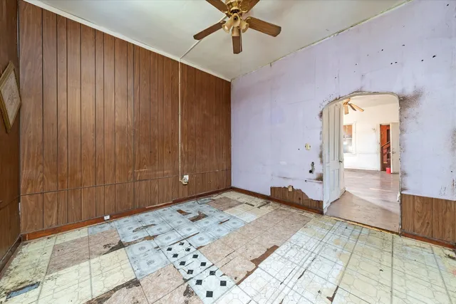 a view of an empty room and hallway