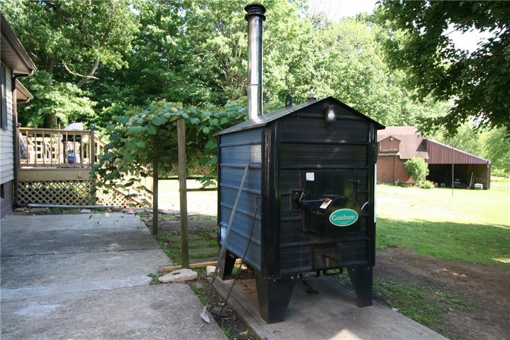 1640 Rutledge Road Transfer, PA 16154 - Photo 13 of 18 Outside wood burner