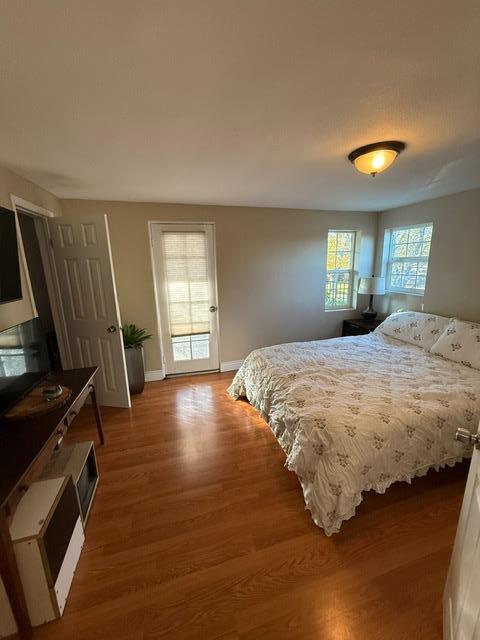 7610 Miller Avenue Gilroy, CA 95020 - Photo 18 of 49 a bedroom with a bed and dresser with wooden floor