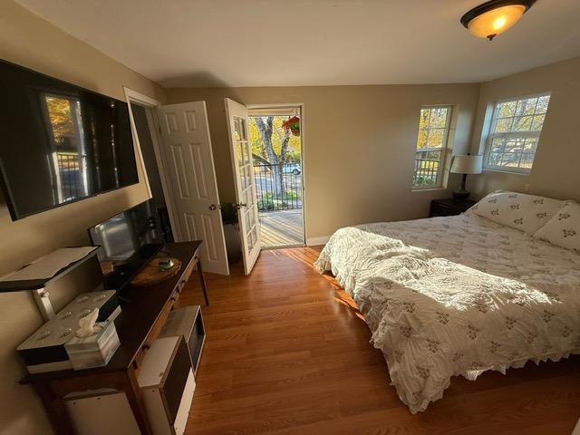 7610 Miller Avenue Gilroy, CA 95020 - Photo 19 of 49 a bedroom with a bed and wooden floor