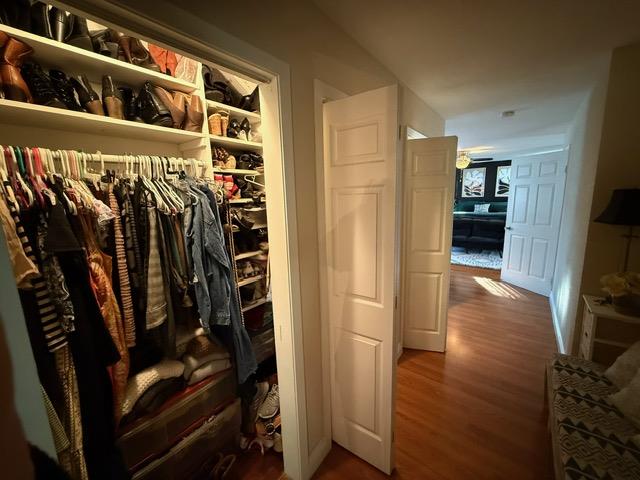 7610 Miller Avenue Gilroy, CA 95020 - Photo 21 of 49 a view of walk in closet with clothes and shoes