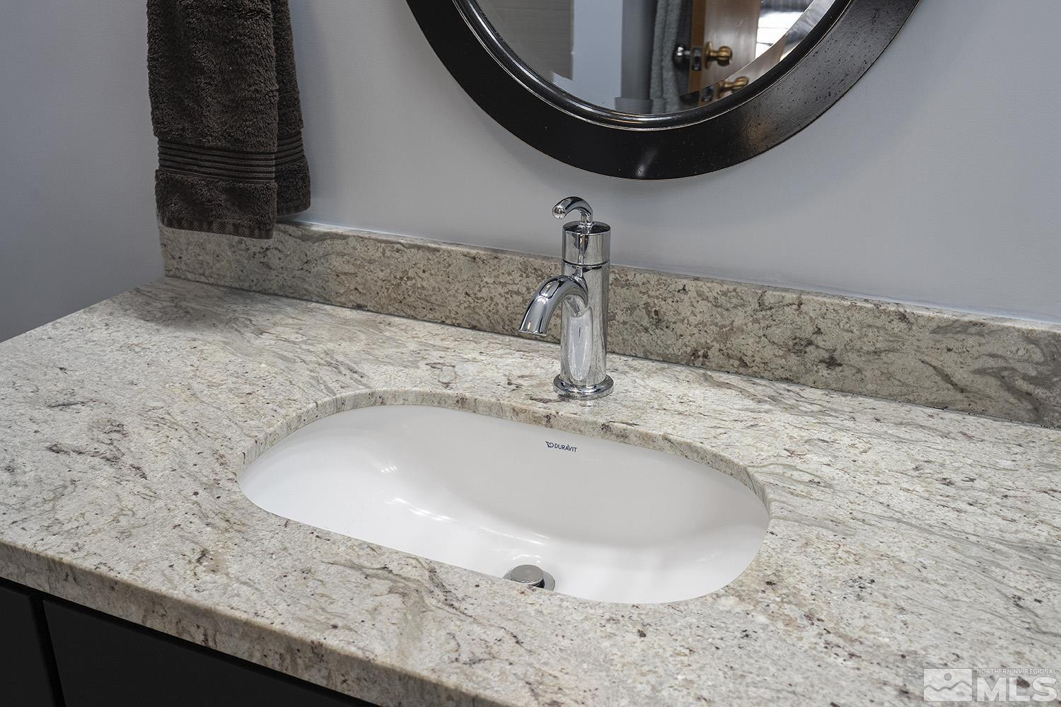 3310 Cashill Boulevard Reno, NV 89509 - Photo 23 of 40 a bathroom with a sink and a mirror