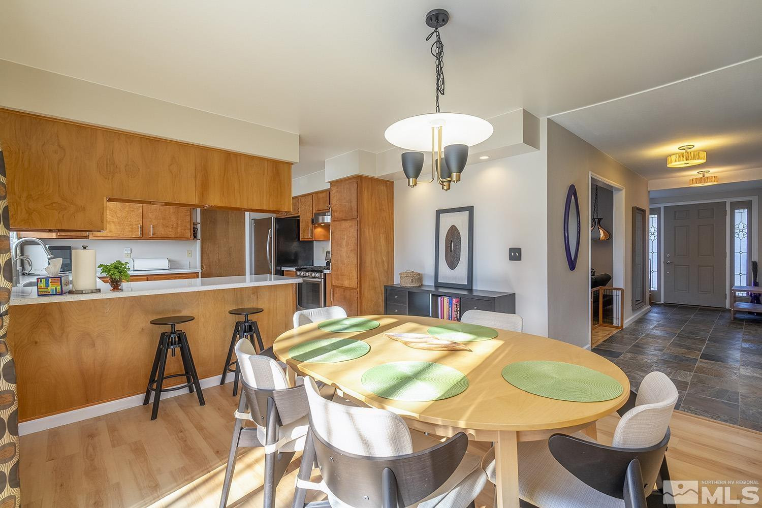 3310 Cashill Boulevard Reno, NV 89509 - Photo 3 of 40 a view of a dining room with furniture and wooden floor