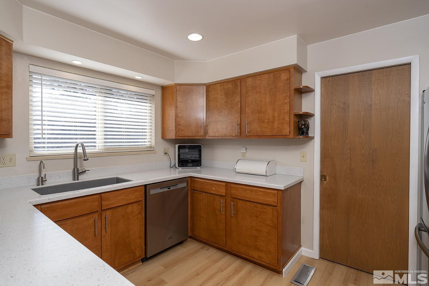3310 Cashill Boulevard Reno, NV 89509 - Photo 6 of 40 a kitchen with a sink cabinets and window
