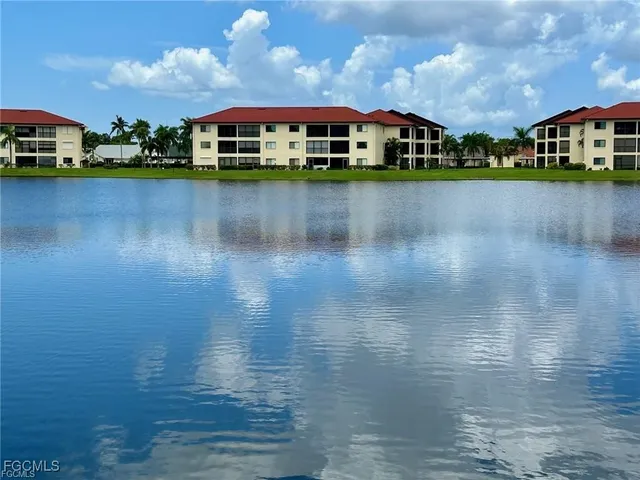 a front view of a house with a lake view