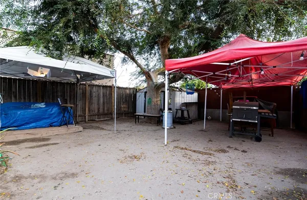 a view of a chairs and table in the patio