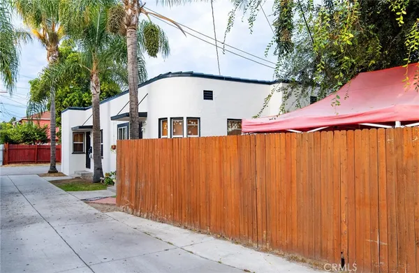 an outdoor view of house with umbrella