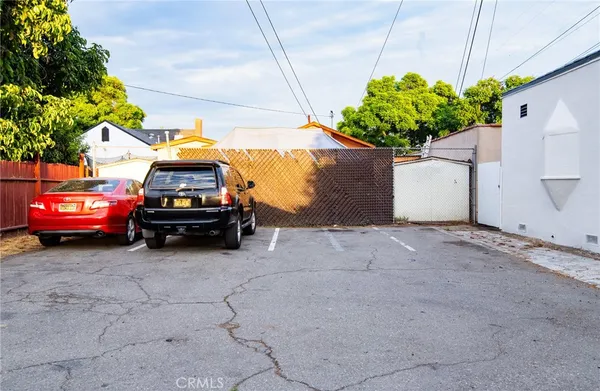 a view of a car that is parked in a parking area