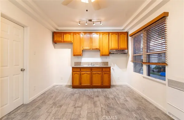 a view of a kitchen with a sink and a window