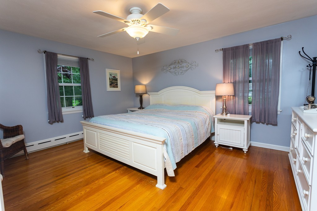 64 Ridge Road Longmeadow, MA 01106 - Photo 16 of 29 a bedroom with a bed and wooden floor