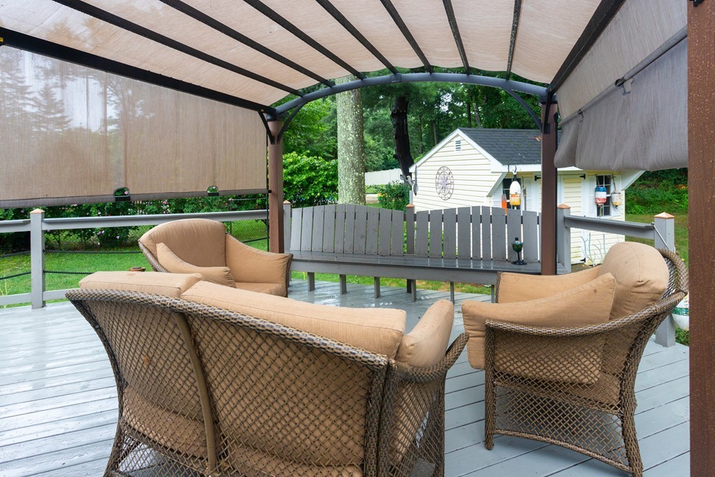 64 Ridge Road Longmeadow, MA 01106 - Photo 26 of 29 a view of a patio with a table chairs and a backyard