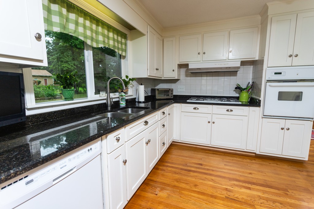 64 Ridge Road Longmeadow, MA 01106 - Photo 8 of 29 a kitchen with granite countertop white cabinets and white appliances