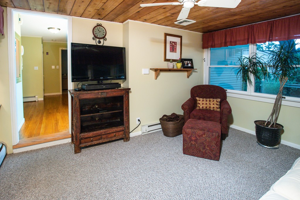 64 Ridge Road Longmeadow, MA 01106 - Photo 10 of 29 a living room with furniture and a flat screen tv