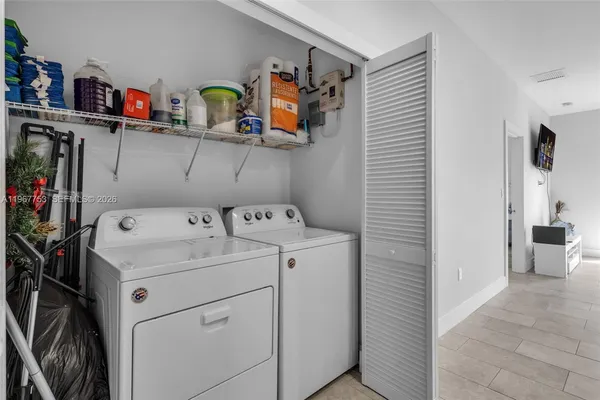 a utility room with dryer and washer