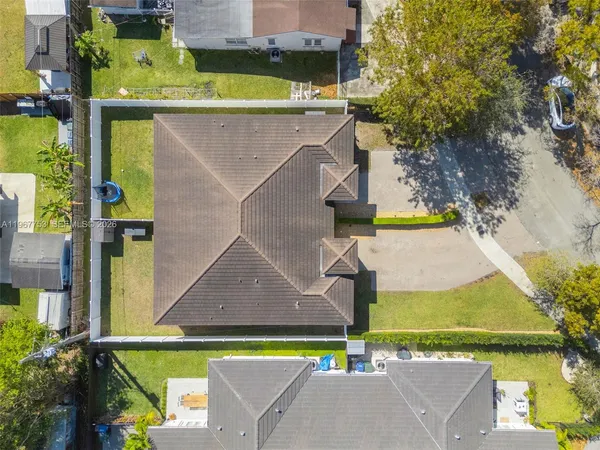 an aerial view of a house with a swimming pool