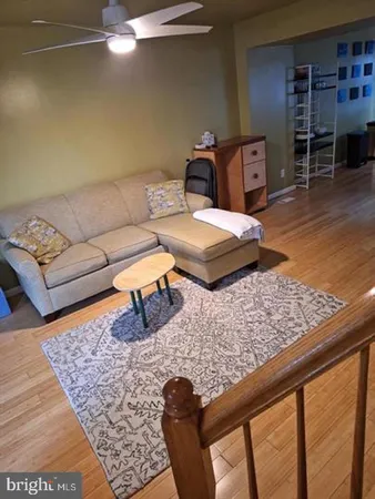 a view of kitchen and dining room with wooden floor