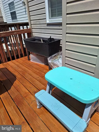 a view of a patio with wooden floor
