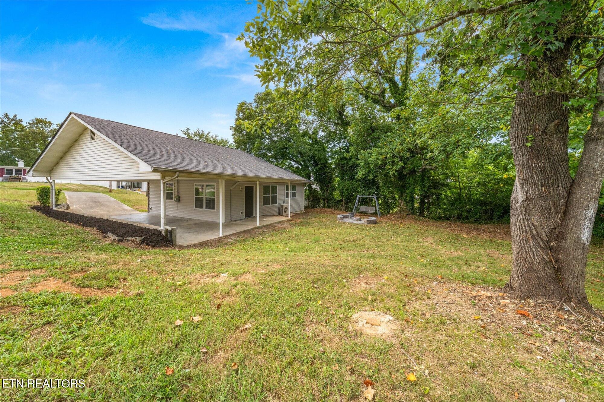103 Parsons Road Oak Ridge, TN 37830 - Photo 15 of 27 a house with swimming pool in front of it