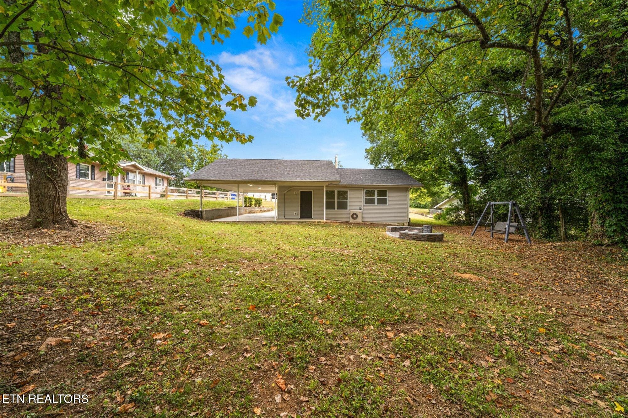 103 Parsons Road Oak Ridge, TN 37830 - Photo 17 of 27 a front view of a house with yard and green space