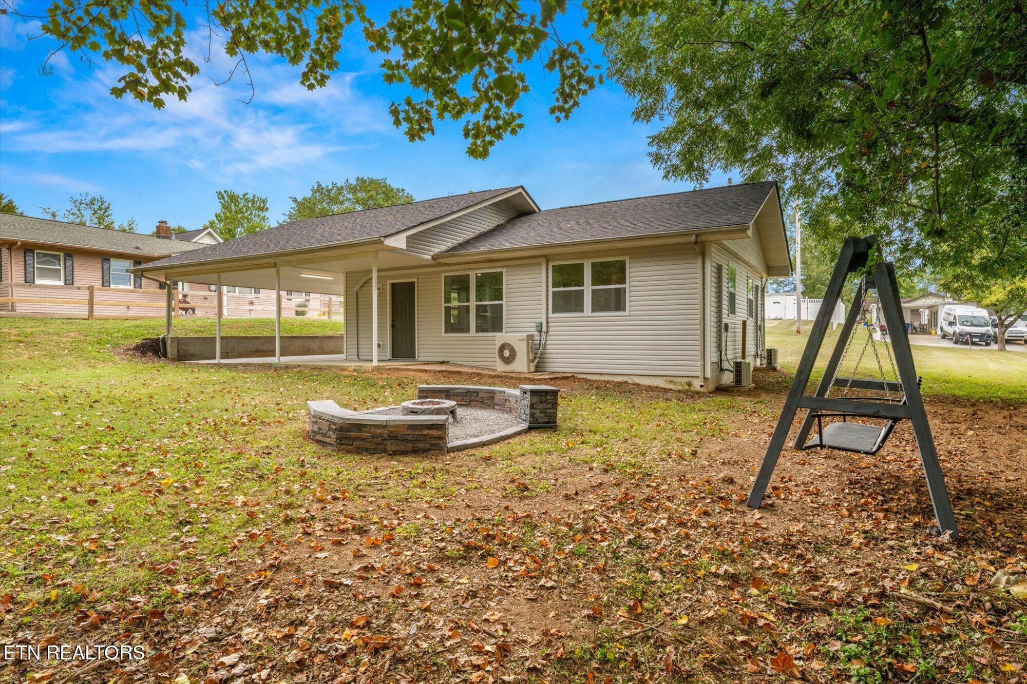 103 Parsons Road Oak Ridge, TN 37830 - Photo 19 of 27 a view of a house with backyard and sitting area