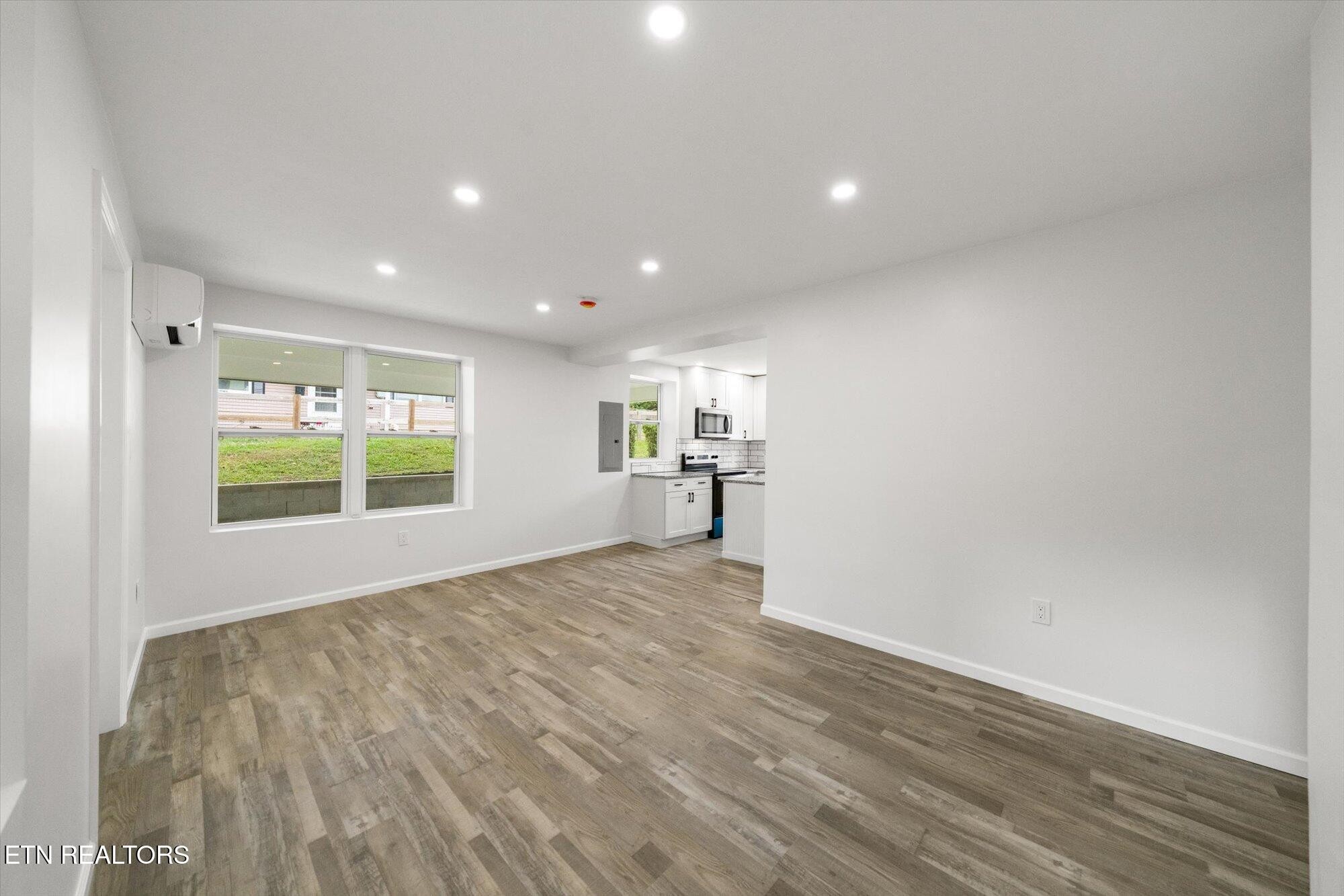 103 Parsons Road Oak Ridge, TN 37830 - Photo 6 of 27 a view of a big room with wooden floor and windows