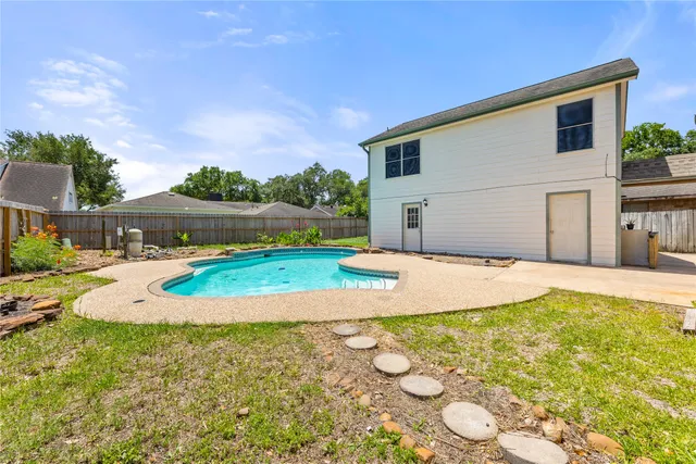 a view of a house with a yard and garage