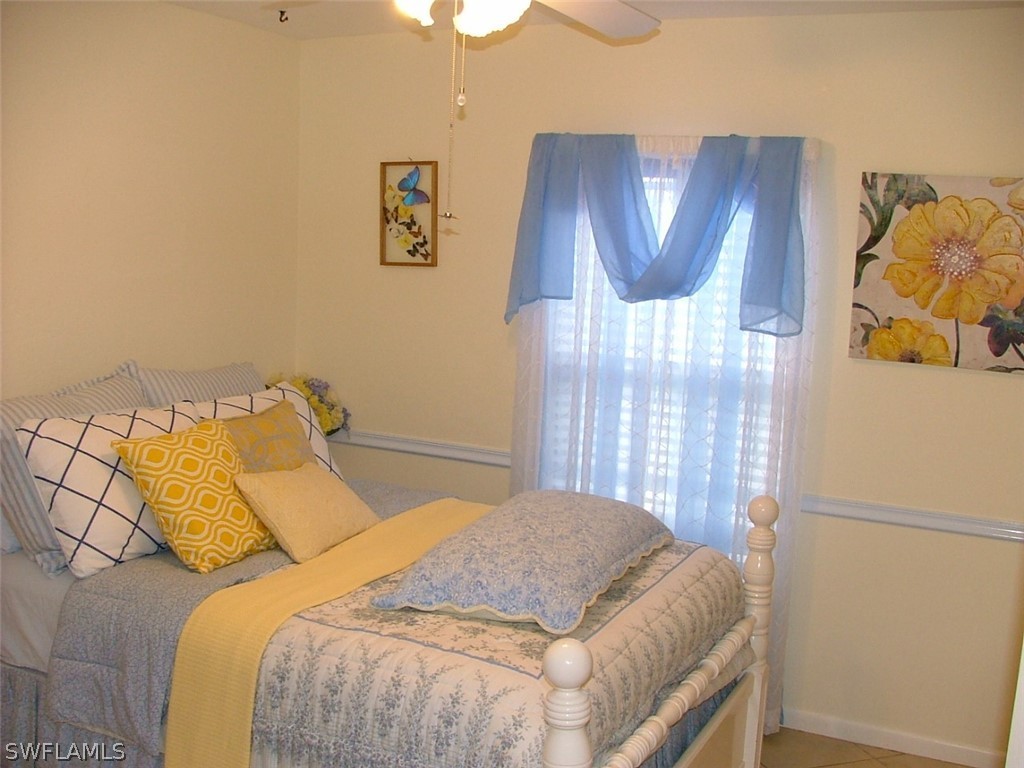 17408 Lebanon Road Fort Myers, FL 33967 - Photo 12 of 20 a bedroom with a bed and wooden floor