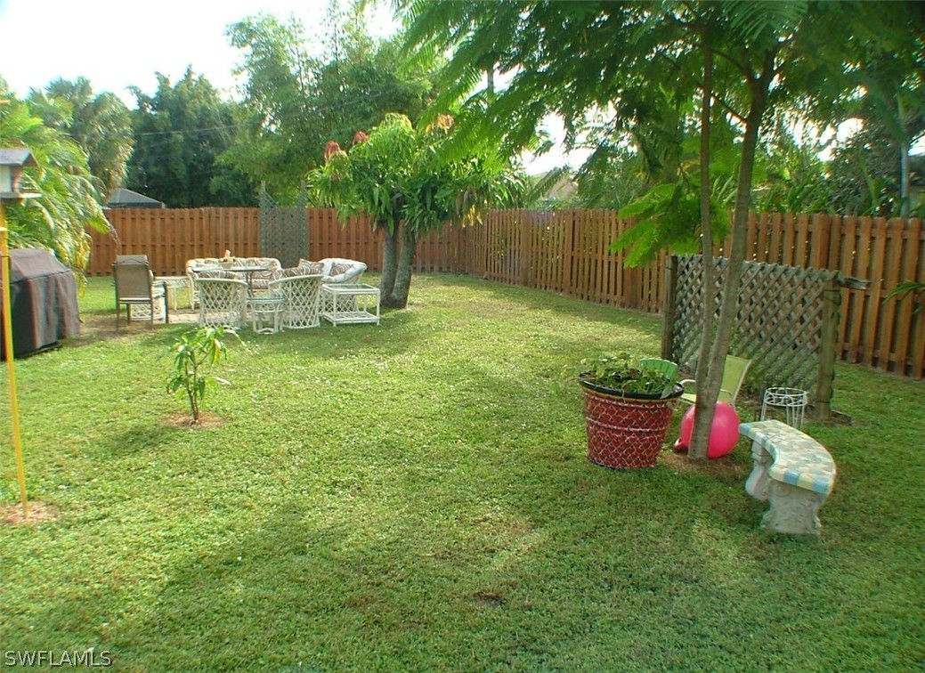 17408 Lebanon Road Fort Myers, FL 33967 - Photo 17 of 20 a garden view with a seating space