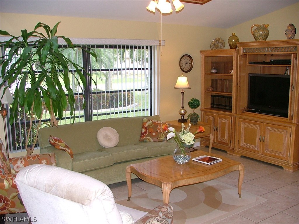 17408 Lebanon Road Fort Myers, FL 33967 - Photo 7 of 20 a living room with furniture a window and a potted plant