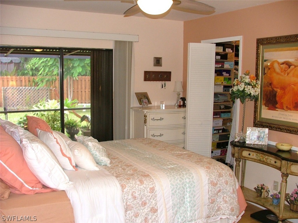 17408 Lebanon Road Fort Myers, FL 33967 - Photo 10 of 20 a bedroom with a bed and a large window