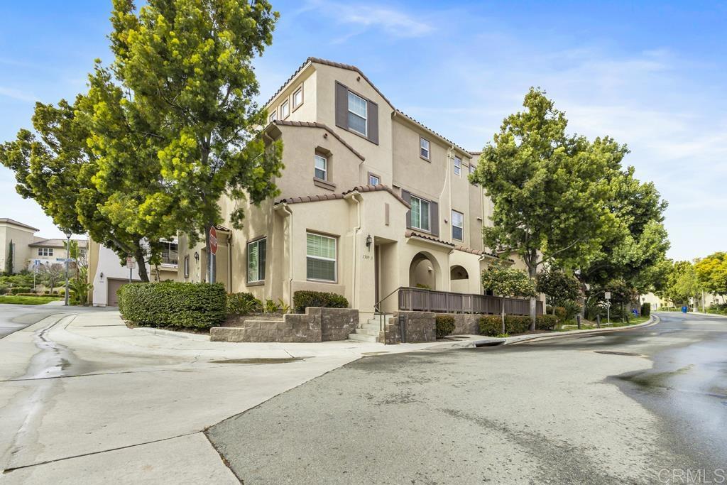 1309 Mother Lode Way, Unit 1 Chula Vista, CA 91913 - Photo 1 of 1 a front view of a house with a yard