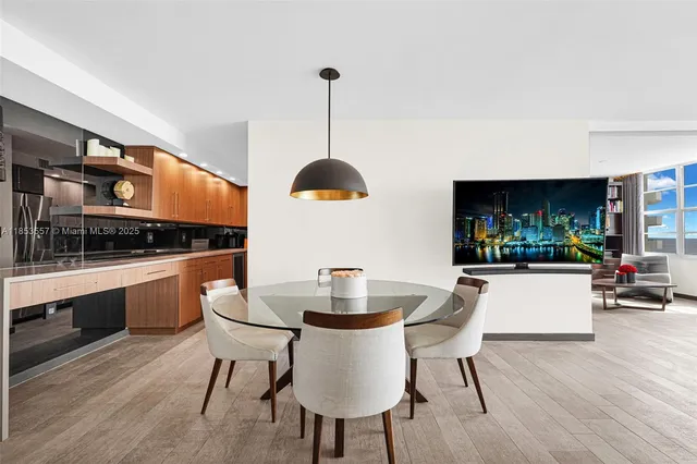 a kitchen with a table and chairs in it