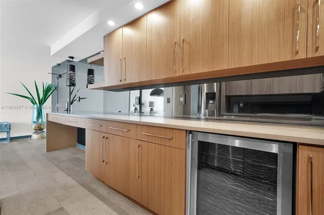 a kitchen with stainless steel appliances granite countertop a sink and a cabinets